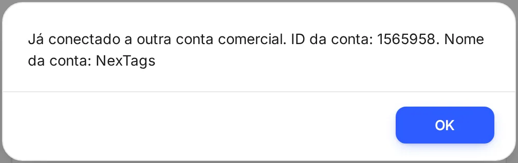 Aviso Já conectado a outra conta comercial, com o ID e o nome da conta onde o canal está, e o botão OK.